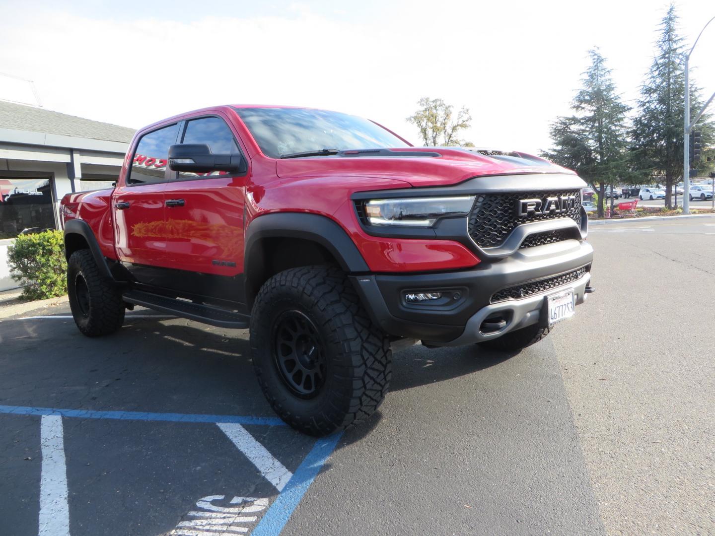 2023 Red /BLACK RAM 1500 Ram 1500 TRX Crew Cab 4x4 (1C6SRFU9XPN) with an 6.2L Supercharged HEMI V8 SRT engine, 8 Speed Auto 8HP95 transmission, located at 2630 Grass Valley Highway, Auburn, CA, 95603, (530) 508-5100, 38.937893, -121.095482 - Must see TRX featuring Eibach front and rear springs, 18" Method NV double black wheels, 37" Nitto Ridge Grappler tires, and window tint. - Photo#2